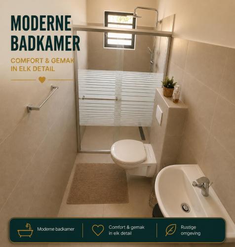 a bathroom with a white toilet and a sink at Casa Trankilo in Fontein