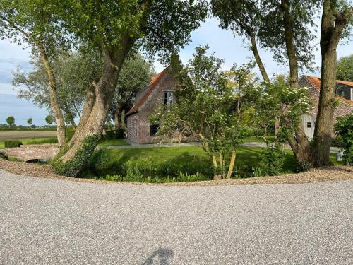 a shadow of a person standing in front of a house at Bellefleur in Veurne
