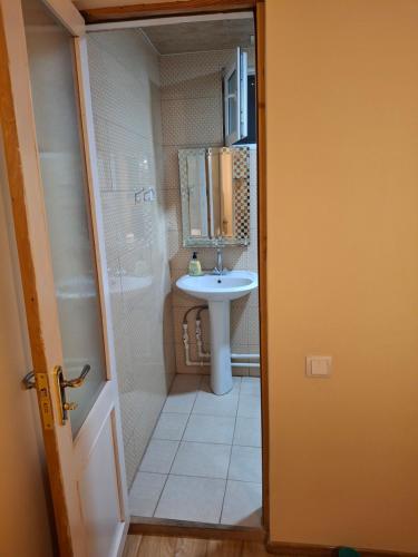 a bathroom with a sink and a mirror at Andranik B&B in Goris