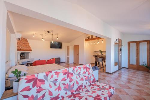 a living room with a couch and a kitchen at Studio apartma Kamin in Nova Vas