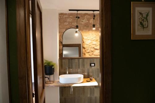 a bathroom with a sink and a mirror at Casale dei cappuccini in Scurcola Marsicana