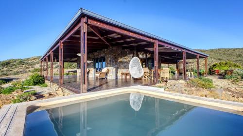 a house with a swimming pool in front of it at Eldorado TopHouse in McGregor