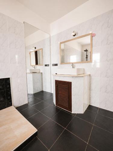 a bathroom with a sink and a mirror at Villa Giacomelli Samui in Taling Ngam Beach