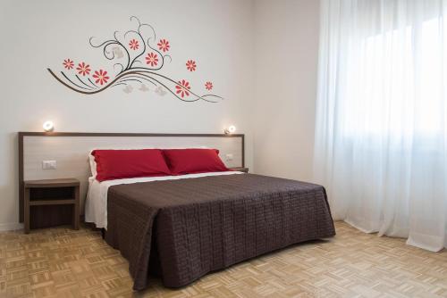 En eller flere senge i et værelse på A Due Passi Dal Cielo