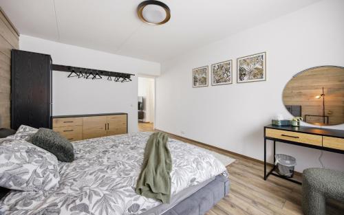a bedroom with a bed and a desk at Hygge House Elva in Elva