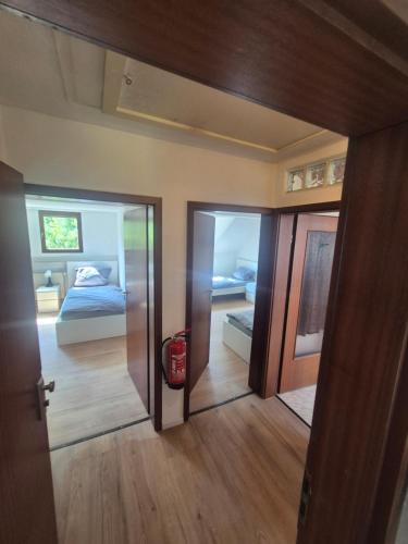 a room with a bedroom with a bed and a door at Stay Offenbach in Bürgel