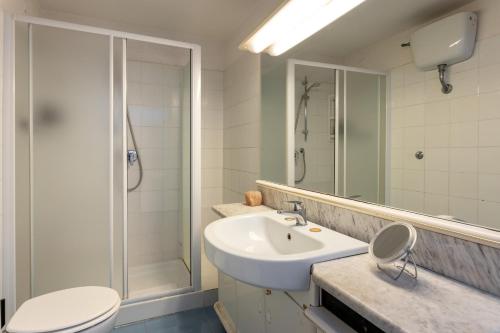 a bathroom with a sink and a shower and a toilet at Bohemian Palace Florence in Florence
