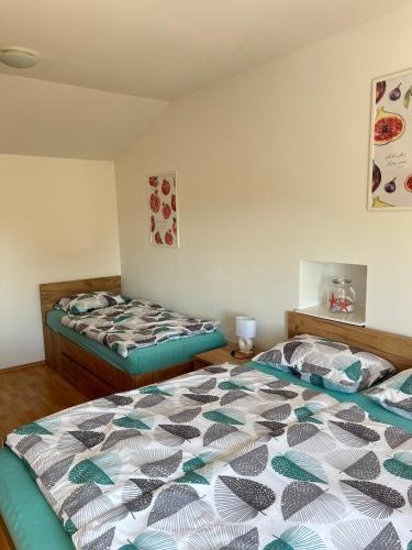 a bedroom with two beds in a room at Apartment Panger in Izola