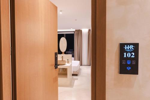 an open door to a room with a bathroom at Heavenly Rest Luxury Hotel in Sarandë
