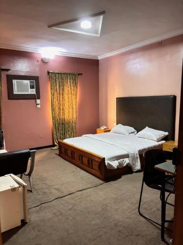 a bedroom with a large bed in a room at Diamond Hotel Lagos in Lagos