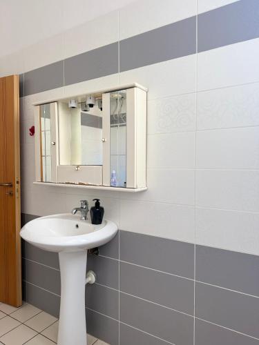 a bathroom with a sink and a mirror at AS Orikum 1 in Orikum