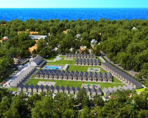 an aerial view of a park with the ocean in the background at Holiday Park & Resort Niechorze Rewal in Niechorze