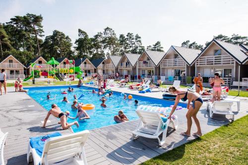 a group of people playing in a swimming pool at Holiday Park & Resort Niechorze Rewal in Niechorze