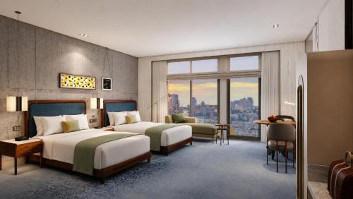 a hotel room with two beds and a window at InterContinental Jerusalem by IHG in Jerusalem