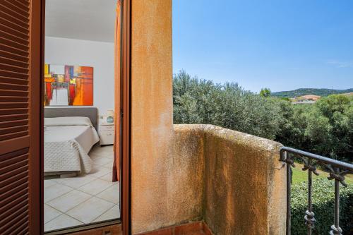 a view of a bedroom from a balcony at Il Balcone su Tavolara in Porto San Paolo