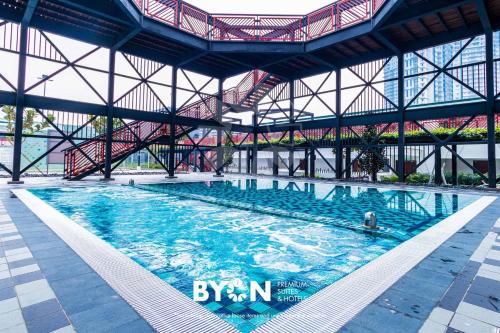 a large swimming pool in a large building at Geo38 Premium Suites Genting Highlands by BYON in Genting Highlands