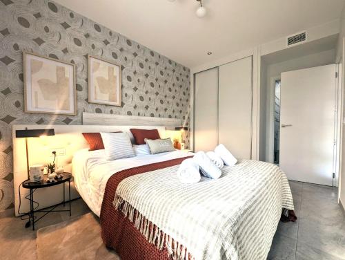 a bedroom with two beds and a wall at Xava Dreams Aire in Villacosta