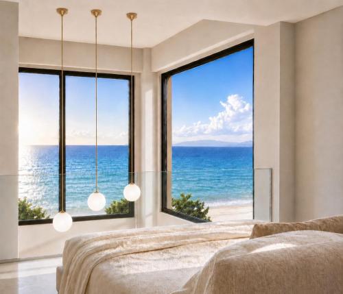 a bedroom with a view of the ocean at athanasia sea view home front house in Polychrono