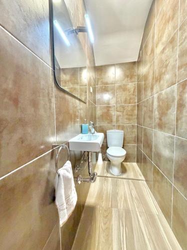 a bathroom with a toilet and a sink at Terrasol Zayamar in Caleta De Velez