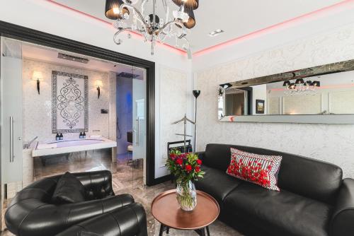 a living room with a couch and a table at Diamond Suites by Reykjavik Keflavik Airport in Keflavík