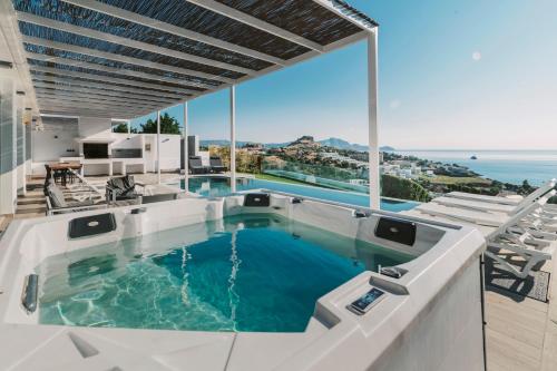 a swimming pool with a view of the ocean at Cavo Lindos Villas in Lindos