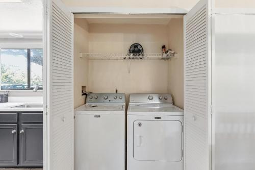 a laundry room with a washer and dryer at Sea Woods 115 in New Smyrna Beach