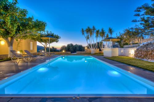 a swimming pool in the backyard of a house at Nautilus Villa - Private Pool in Elaía