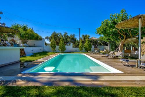 a swimming pool in the backyard of a house at Nautilus Villa - Private Pool in Elaía