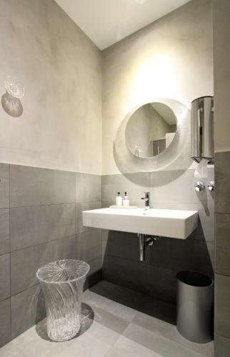 a bathroom with a sink and a mirror at Hotel Stadt Tuttlingen in Tuttlingen