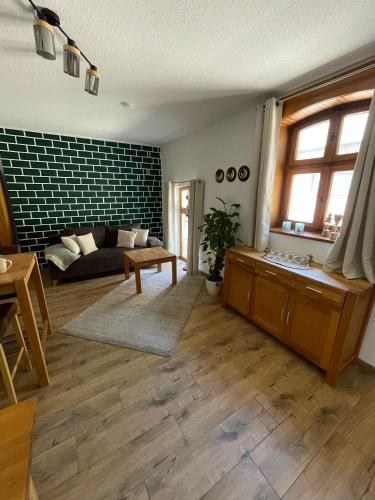 a living room with a couch and a table at Jagdstube in Prezelle