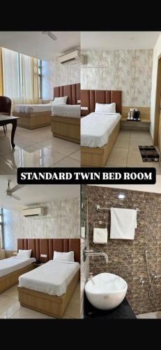 a hotel room with two beds and a bathroom at Vida Hotel in Patiāla