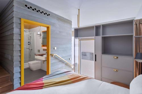 a room with a bed and a bathroom at Eden Locke in Edinburgh