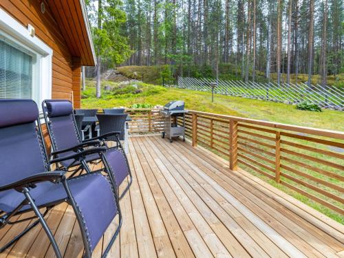 a deck with a grill on a house at Holiday Home Järvelä by Interhome in Kemijärvi