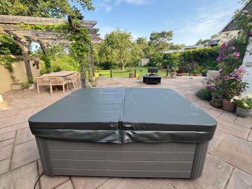 a black container sitting on a patio at Trelawney in Yelverton