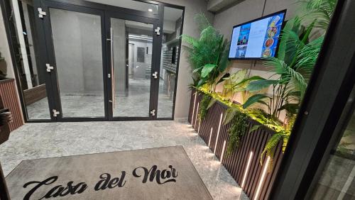 an entrance to a building with a sign that reads iris red mic at Eva Del Mar 1, vedere la mare-parcare gratuita in Mamaia