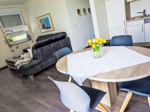 a living room with a table and chairs and a couch at Apartment Ober Langengarten by Interhome in Pittenbach