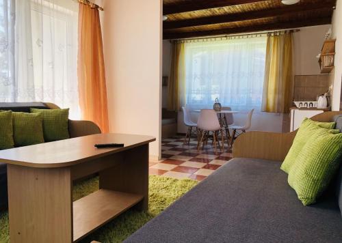 a living room with a couch and a table at Ryn Lake Resort 2 in Ryn