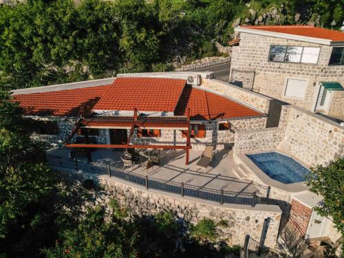 an overhead view of a house with a swimming pool at Step to Kotor bay Perast in Perast