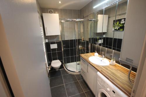 a bathroom with a sink and a shower and a toilet at Close Palais - Calm - Brand New in Cannes