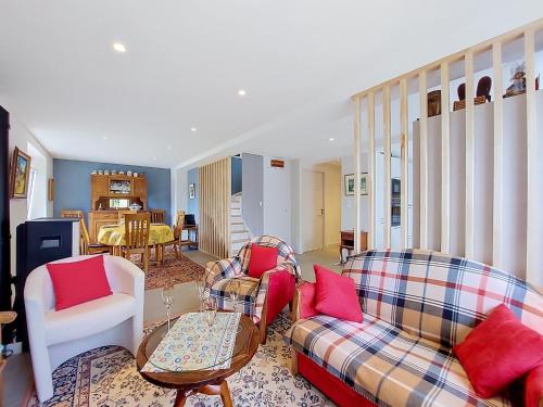 a living room with two couches and red pillows at Apartment Ty PJP by Interhome in Névez