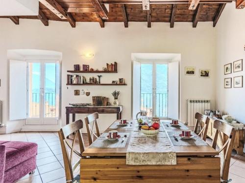 a kitchen and dining room with a table and chairs at Apartment Laghina by Interhome in Musso