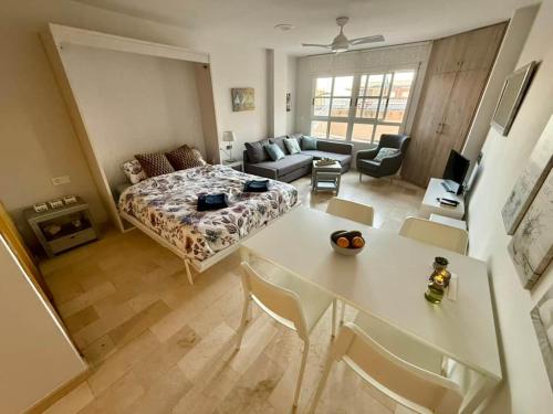 a large living room with a bed and a table at Aguas Salinas A3 Studio in San Pedro del Pinatar