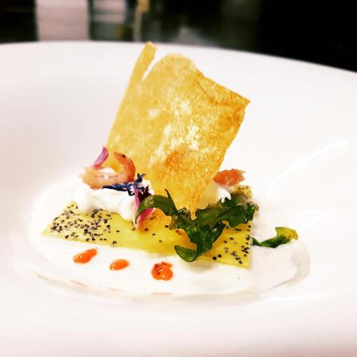 a white plate with a piece of food on it at Do Ciacole In Relais in Mira