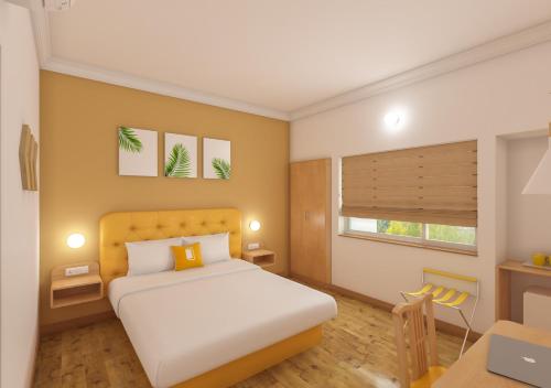 a bedroom with a white bed and a desk at Bloom Hotel Chennai Central in Chennai