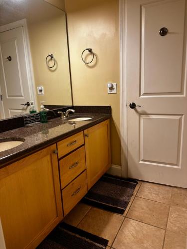 a bathroom with a sink and a mirror at Lake Life Adventures 4 Bedroom Home in Lake Harmony