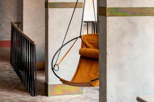 a swing hanging from a wall in a room at Bermonds Locke, Tower Bridge in London