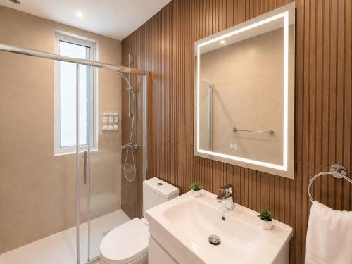 a bathroom with a sink and a toilet and a mirror at Il Kenn ta Zeppi - Apartment 4 in Qala