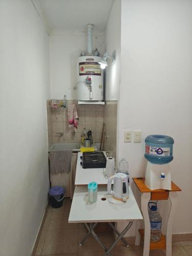 a small kitchen with a counter and a mixer at La Esquina de Norma in General Villegas