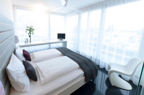 Un ou plusieurs lits dans un hébergement de l'établissement Sky Design Motel