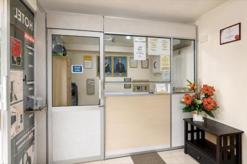 a store entrance with a sliding glass door at Collection O Near Taiping Mall Formerly Axis Hotel in Taiping